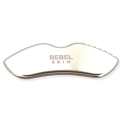 Stainless steel REBEL SCULPT tool for facial massage, tension relief, and lymphatic drainage.